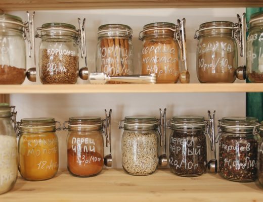 glass jars on wooden shelf